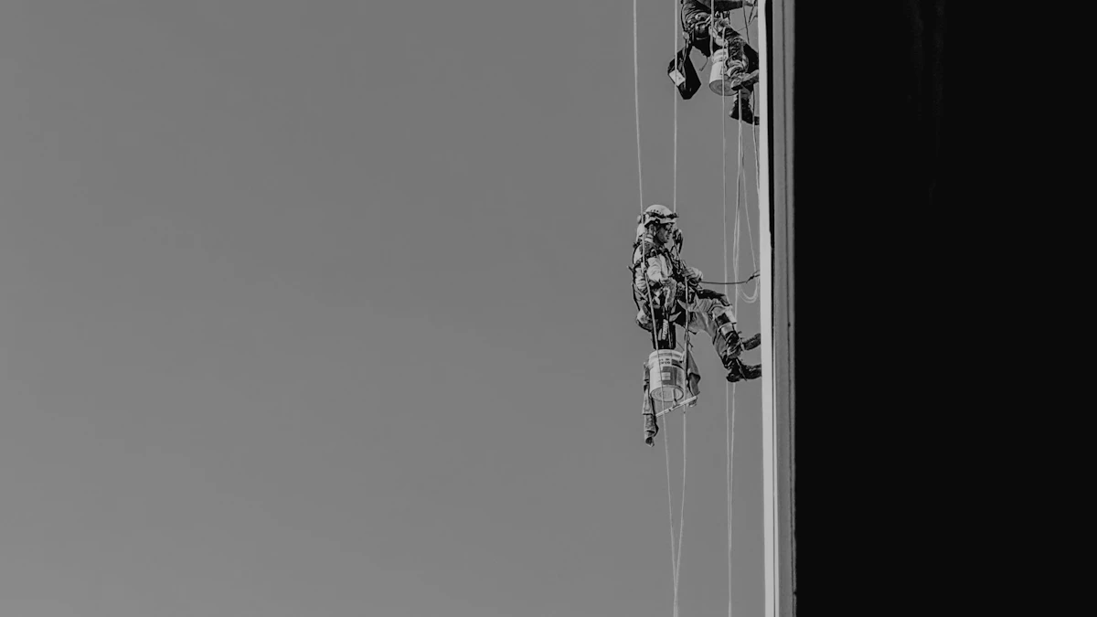Workers suspended by ropes cleaning the exterior of a tall building